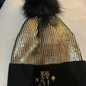 Disney hat gold with black Pom on top